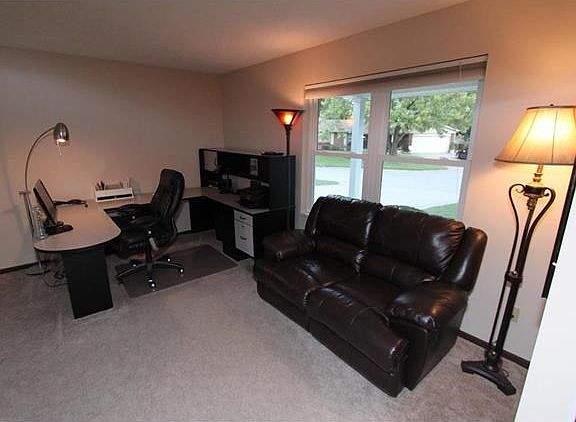 Large room of of the entry foyer with a view of the outside is neutral, clean and move in ready!