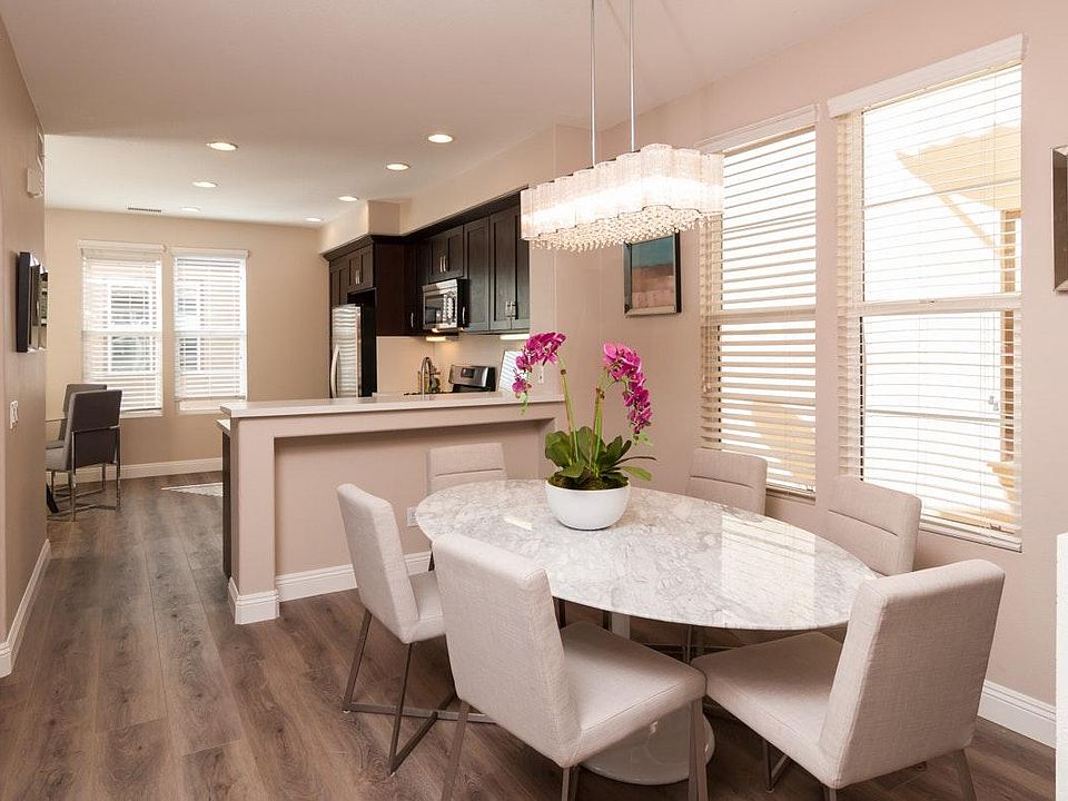 Kitchen and dining area, separate breakfast nook near the back left.