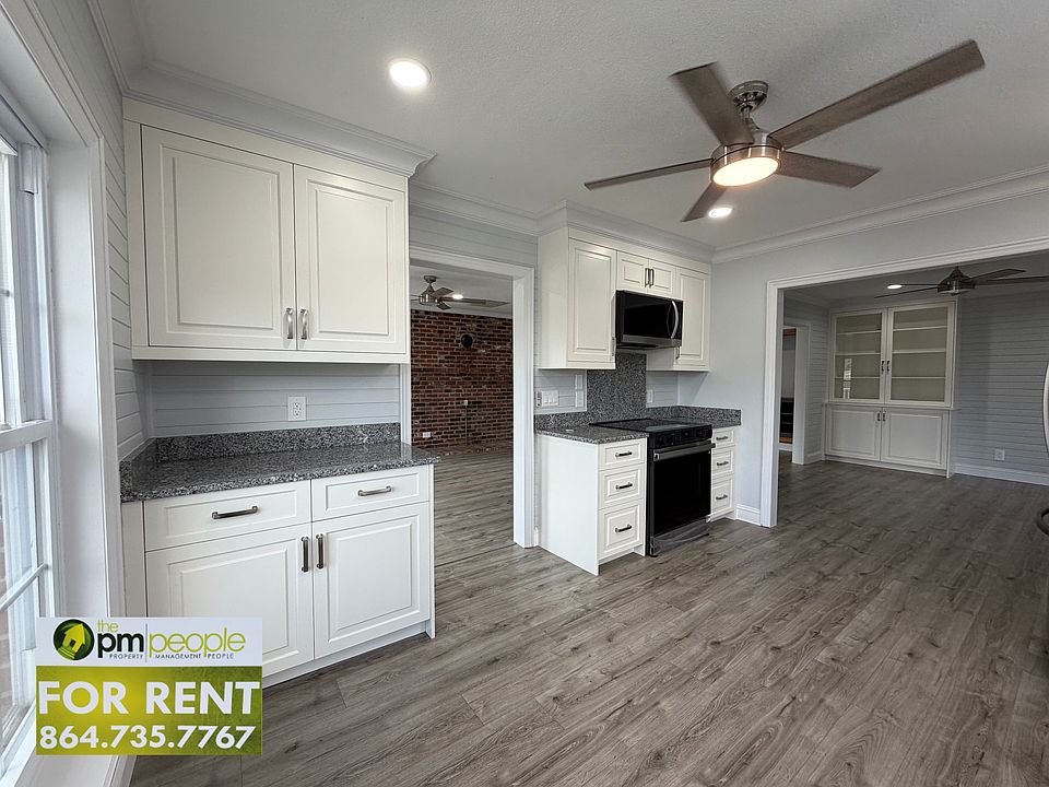 The kitchen boasts new appliances, incredible counterspace, a plethora of cabinet storge and easy access to the living room and dining room.