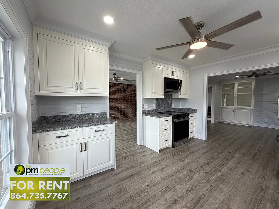The kitchen boasts new appliances, incredible counterspace, a plethora of cabinet storge and easy access to the living room and dining room.