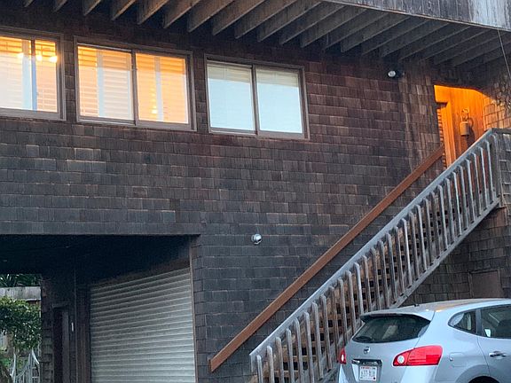 Front of the house with parking for cars