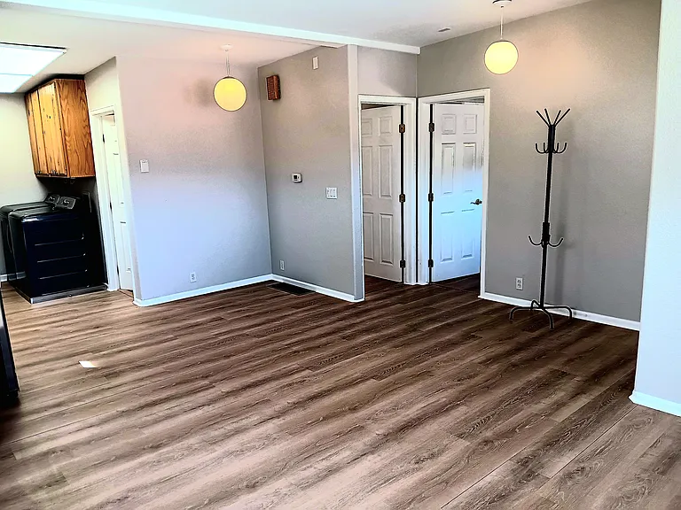 Living room showing entrances to both bedrooms