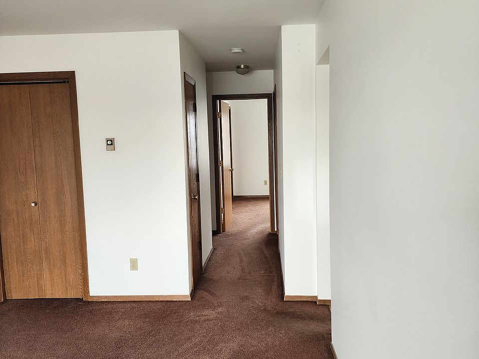 Coat closet in living room. 3 additional closets in hallway leading to bedrooms and bathroom