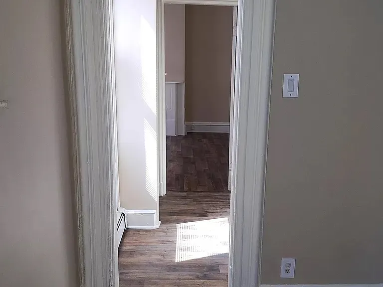 Hallway leading to first bedroom. Double closet for bedroom is in this hallway.
