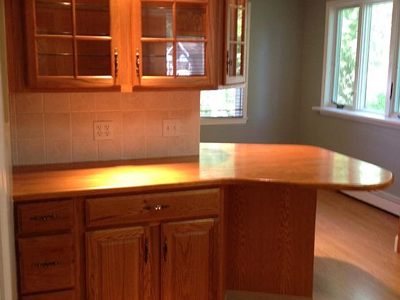 kitchen breakfast bar and light up display cabinets