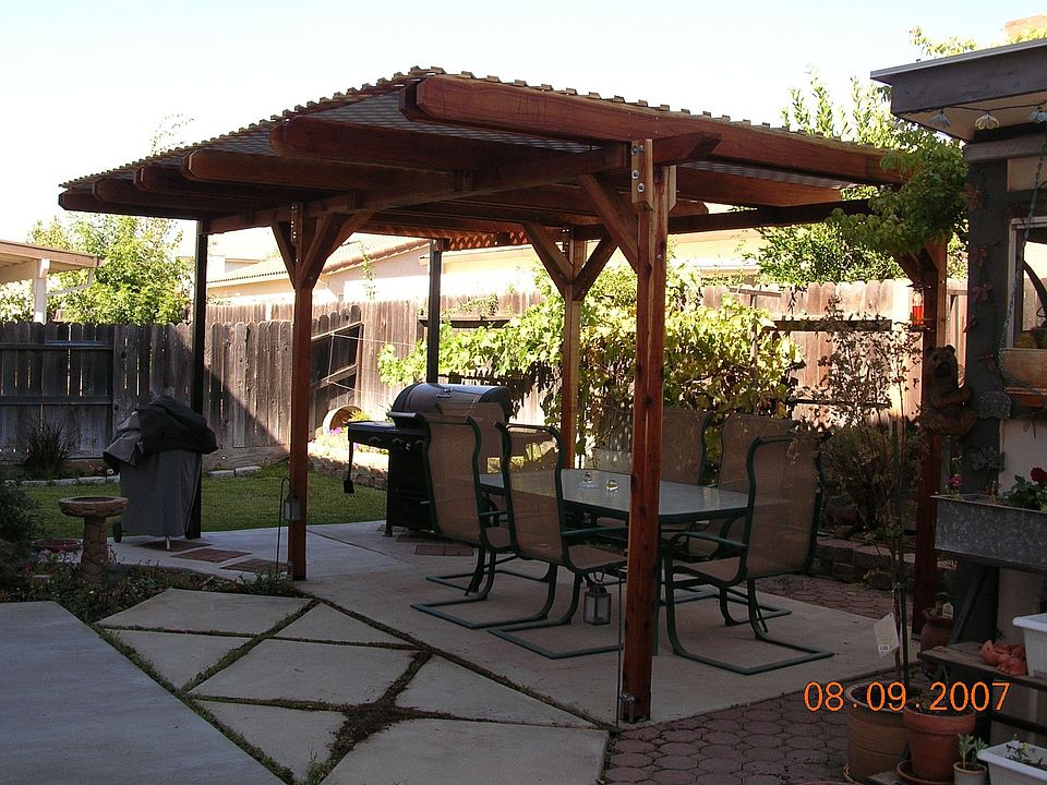 back yard patio cover with built in shade screen