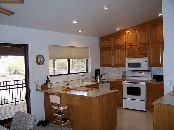 Eat in kitchen has many cabinets