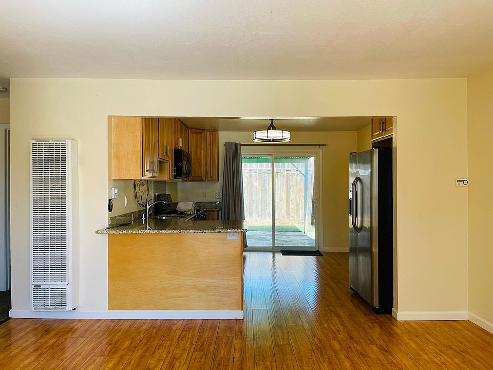 View from living room to kitchen and backyard.