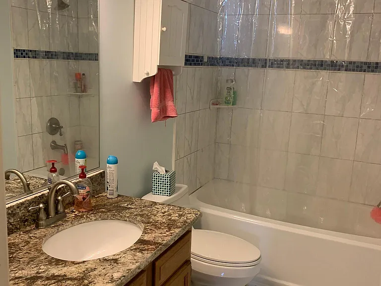 2nd floor full bathroom in hallway.