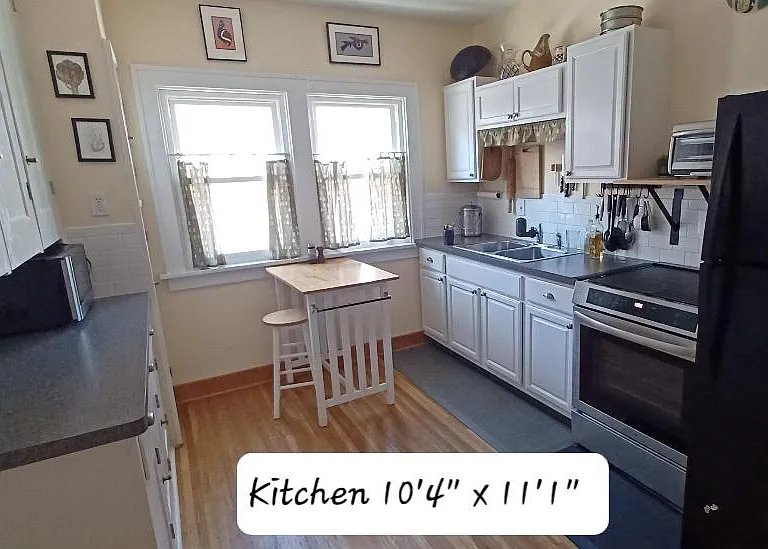 The kitchen has plenty of cabinet space, new induction range, full size refrigerator and microwave. Dishes and utensils provided.