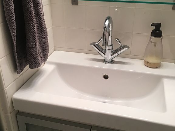 Bathroom including new tiles and fixtures