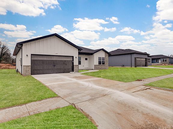 Lawn is digitally added due to being new construction.