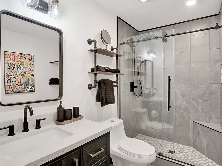 Rain forest showers in Primary and guest bath. The guest bat his the same rain forest design but with dual vanities.