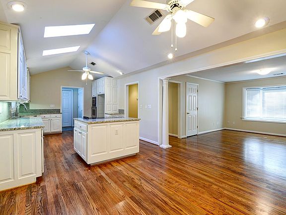 Dining, Kitchen w/skylights, Living room with Bay, Laundry/M