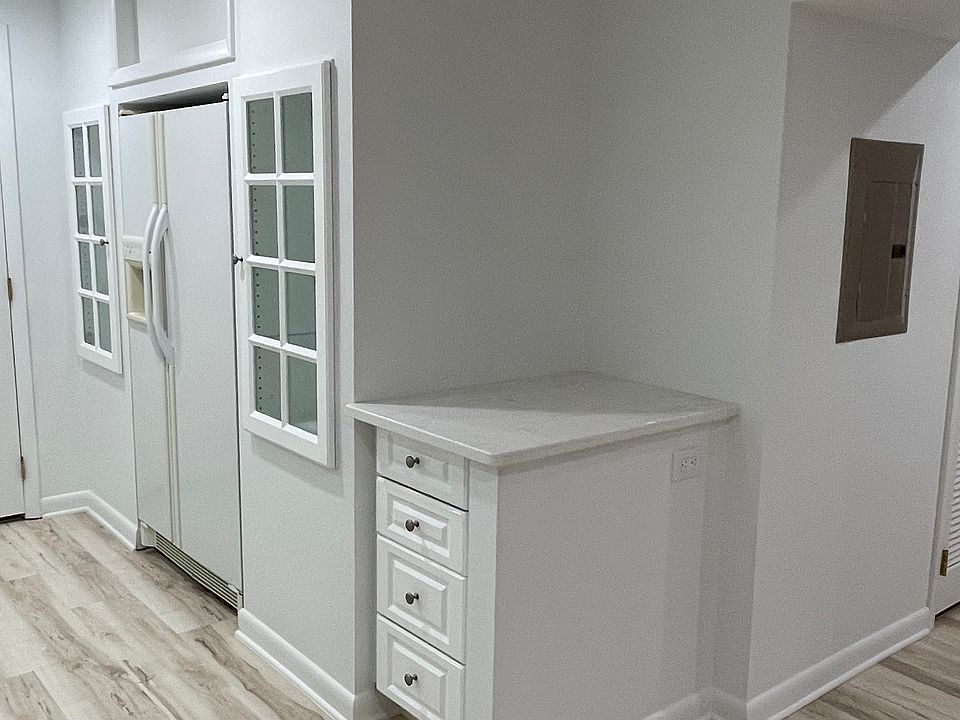 Full size refrigerator and coffee bar.
