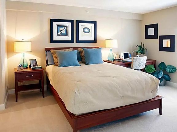 Bright, open bedroom upstairs with walk in closet