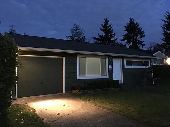 Front of home at night.