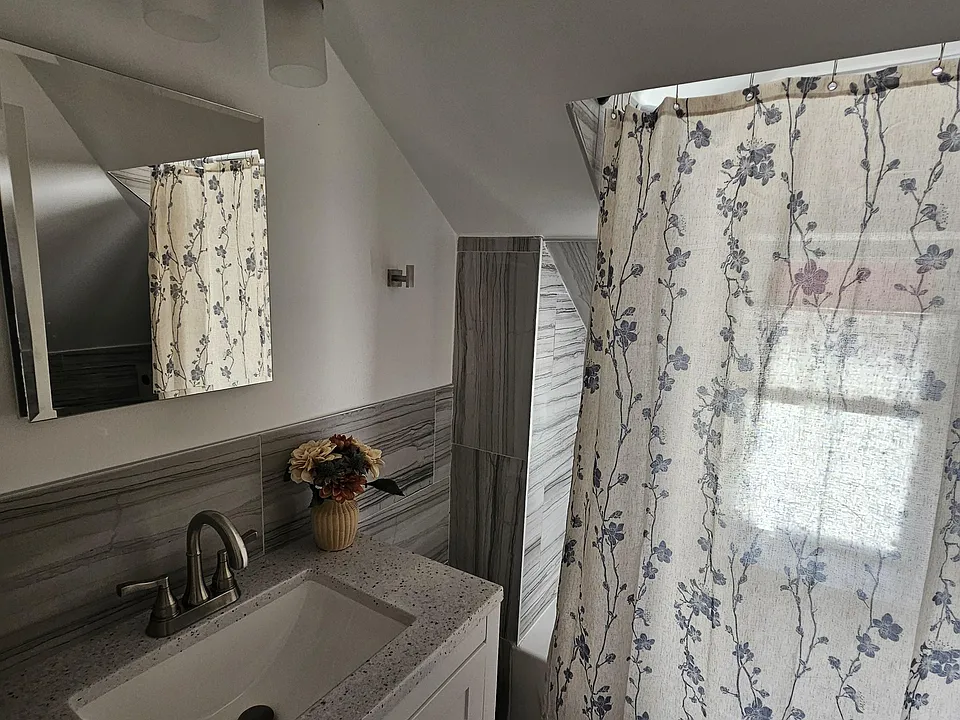 Bath, shower combo. Medicine cabinet.