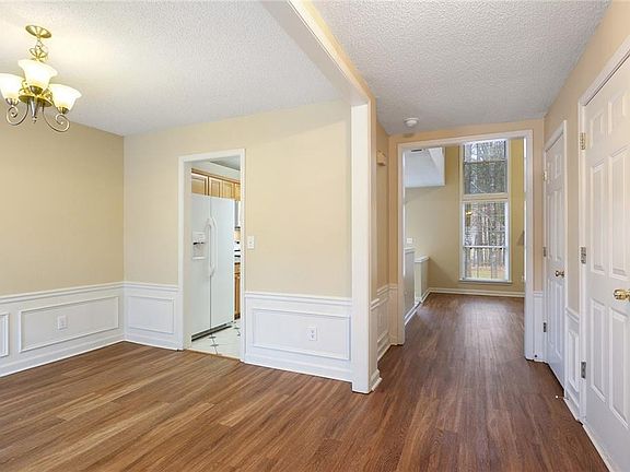 view from the front door area - garage door and coat closet door on the right
