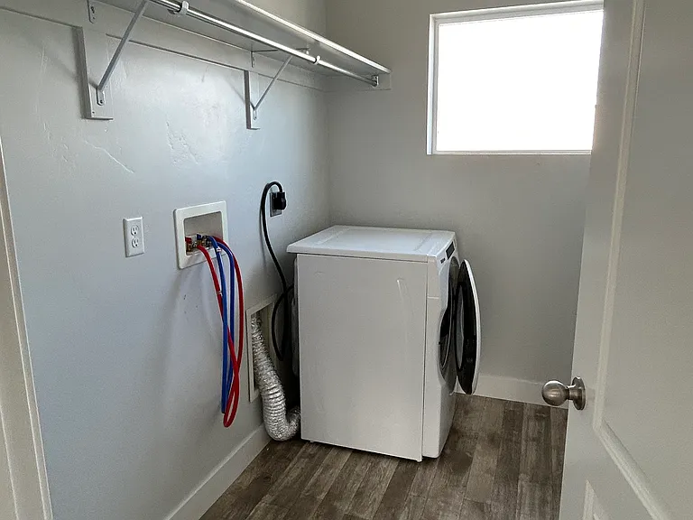 Laundry room. Washer and Dryer available. Washer in garage and will be moved back up