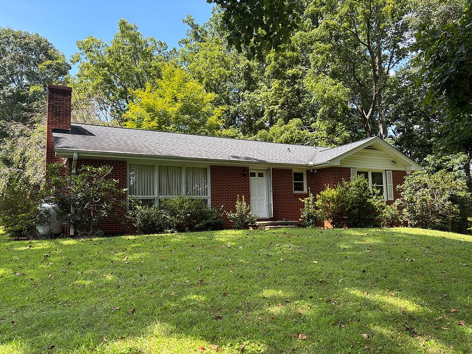 large level front yard with shade trees