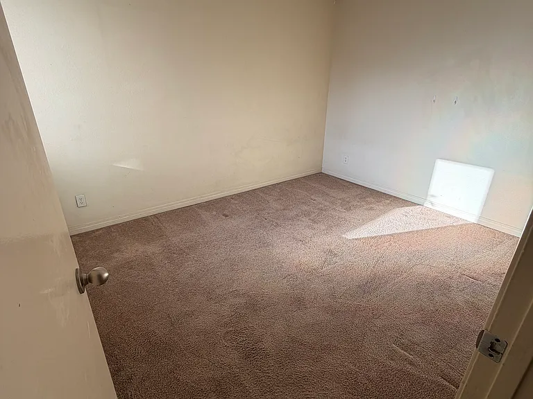 Second bedroom with attached closet and bathroom