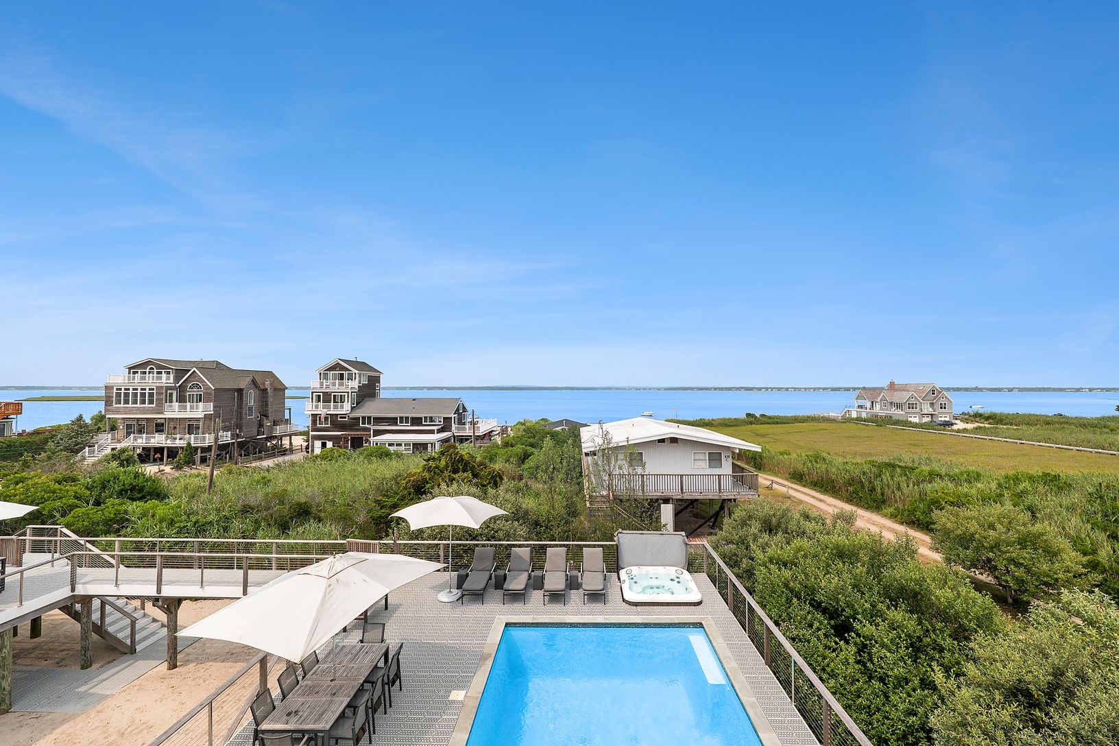 View of gunite pool from pool house upper-deck.