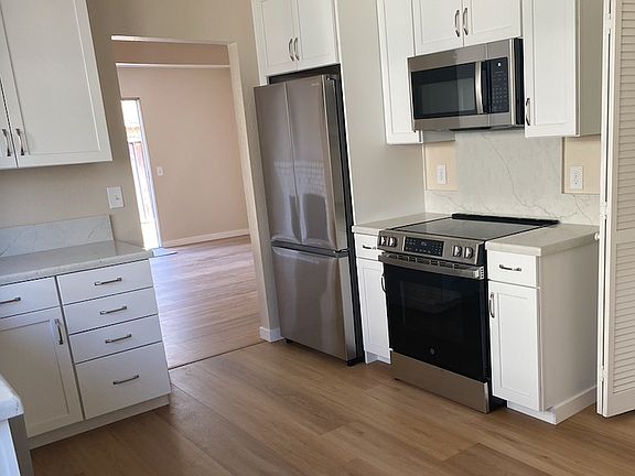 All Brand New Kitchen Appliances (includes washer and dryer to the right)
