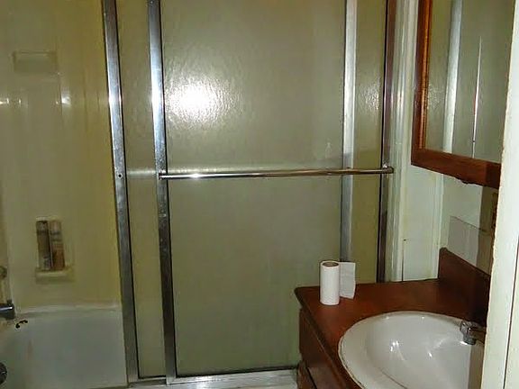 bath with sliding enclosure