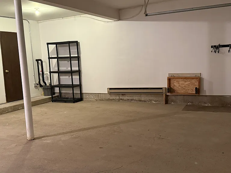 2 car heated garage shared, one stall for this condo, the 2nd stall is for another condo.