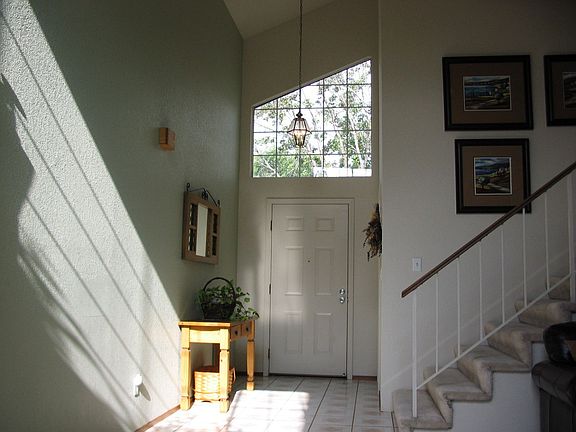 Light & Bright Entry with Volume Ceilings
