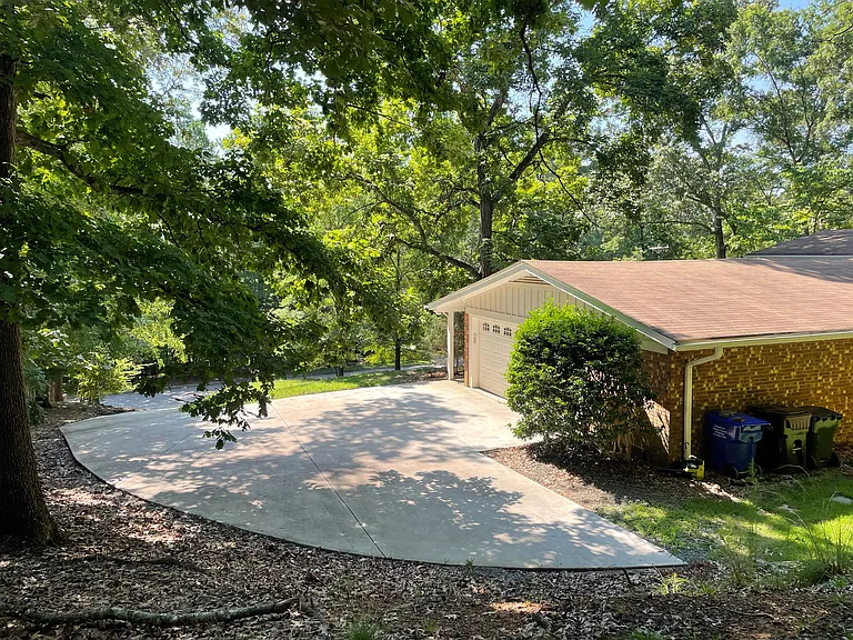 Two-car attached garage, plus driveway parking space.