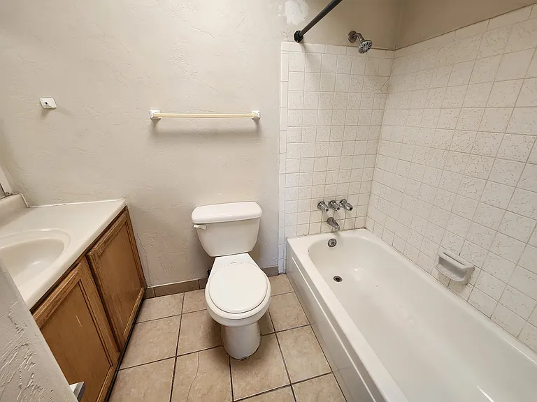 hallway bathroom with tub