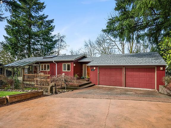Stained and stamped concrete driveway, water bubbler and front deck and doorway.