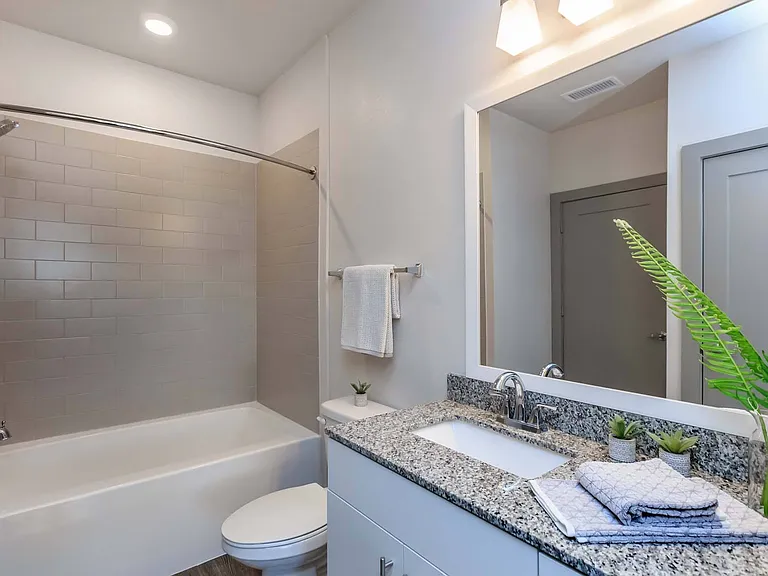 Enjoy a spacious bathroom with modern touches that make your daily routine more comfortable.