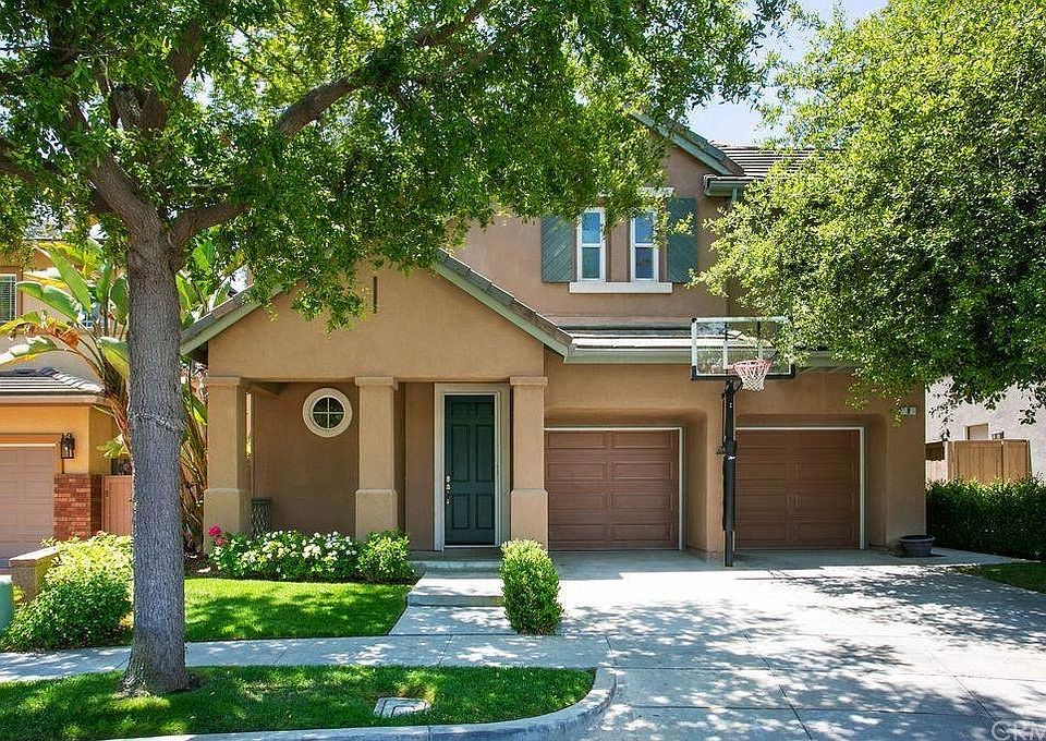 Front of home with built in Basketball Hoop