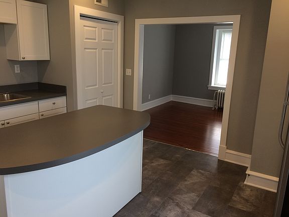 Kitchen looking into living room