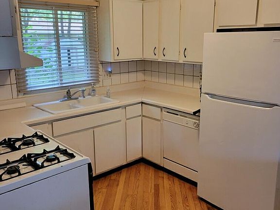 One view of kitchen. Refrigeerator is new