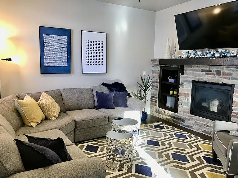 Light and bright great room with flat screen HD TV and fireplace for morning coffe or happy hour.