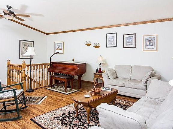 Living  room with new Cortex flooring and remote ceiling fans