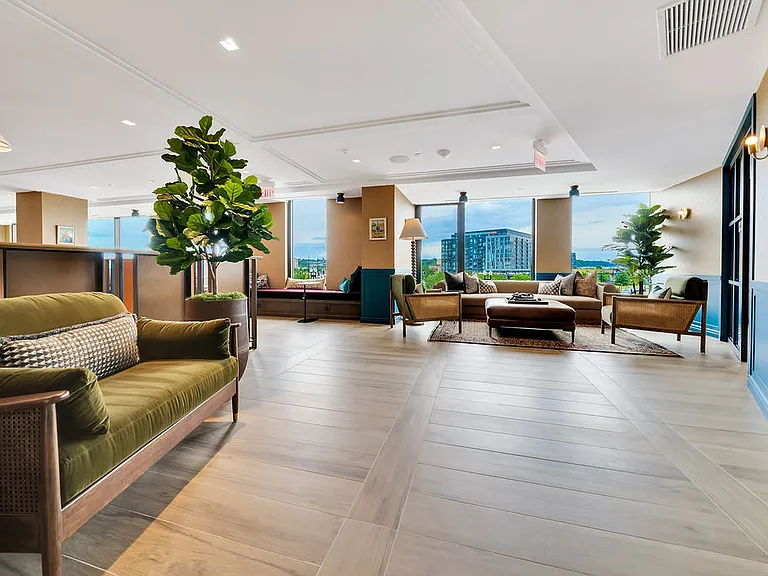 Coworking mezzanine with lounge chairs and WFH spaces.