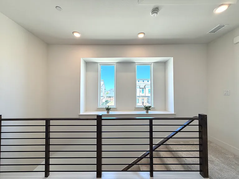Windows fill the home with natural light while showcasing neighborhood views.
