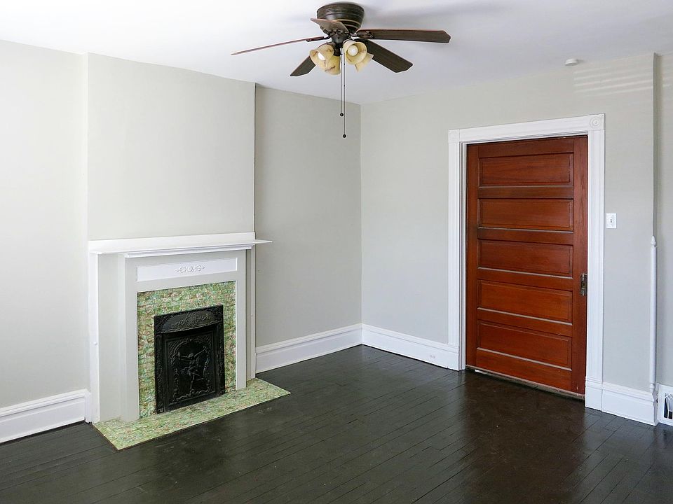 Beautiful refinished pocket door separates the living space from a bedroom area.