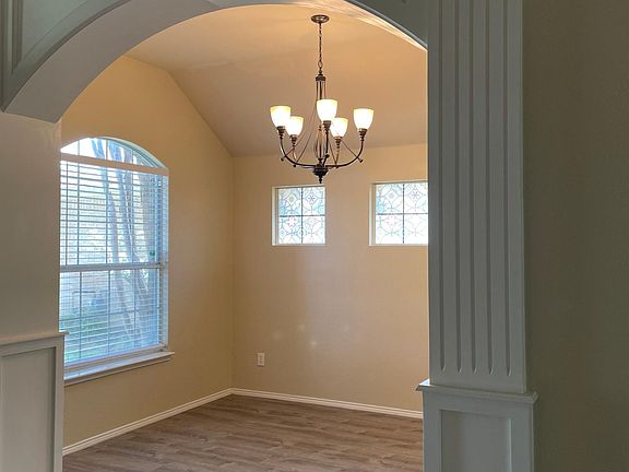 Upgraded wood trim in entry wall to study/office/formal dining room.