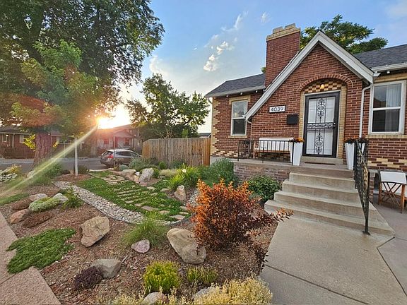 Front exterior and main entrance to home. Faces W 44th Ave.

Waterwise landscaping with TONS of perennials!