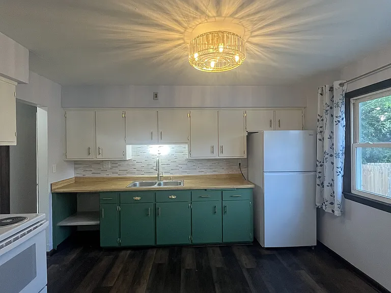 Beautiful kitchen with lots of natural light and easy to clean floors.