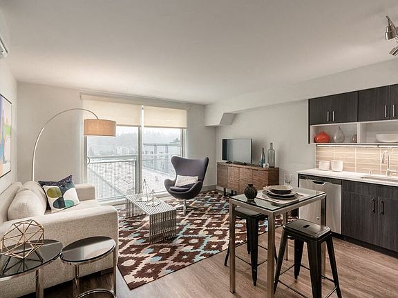Floor-to-ceiling windows with solar shades in South Building apartments