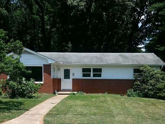 Front of the house. Featuring Fig bushes, Peach Tree, and flowering bushes!
