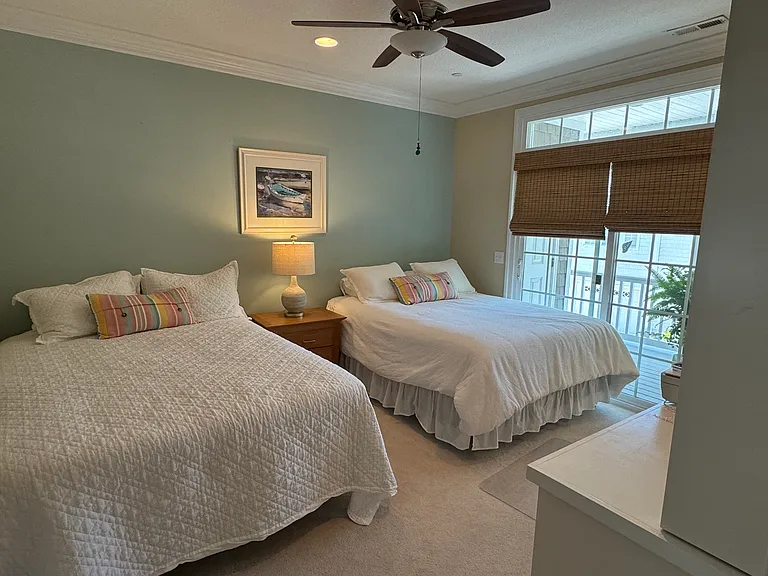 The third bedroom has 2 Queen beds and a desk.