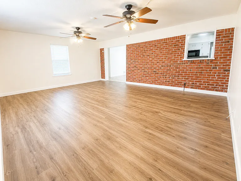 Large living room with vinyl plank flooring